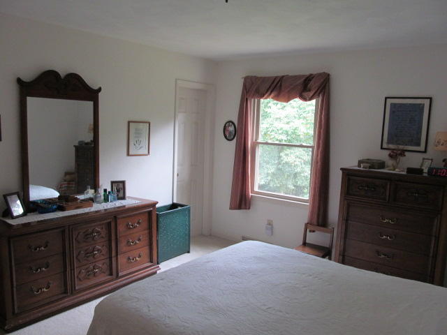 138 Timberline Drive Blue Ridge, VA 24064 - Photo 27 of 32 a bedroom with a bed and a window