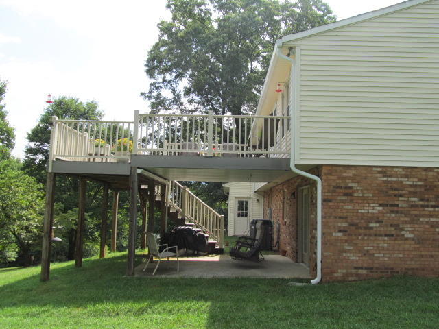 138 Timberline Drive Blue Ridge, VA 24064 - Photo 10 of 32 a view of a house with backyard and porch