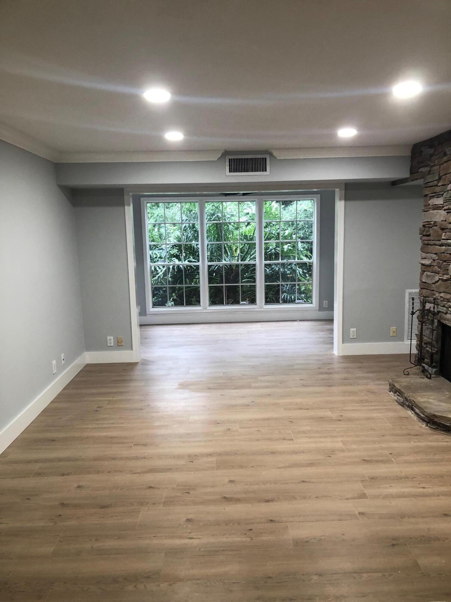 5079 Heatherhill Lane, Unit 70 Boca Raton, FL 33486 - Photo 6 of 26 LIVING ROOM LEADS TO SUNROOM