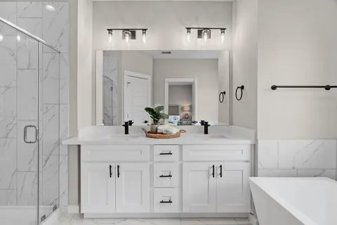 a kitchen with stainless steel appliances a sink stove and wooden floor