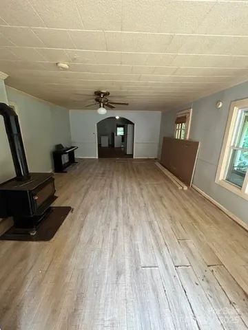 a view of a livingroom with furniture and windows
