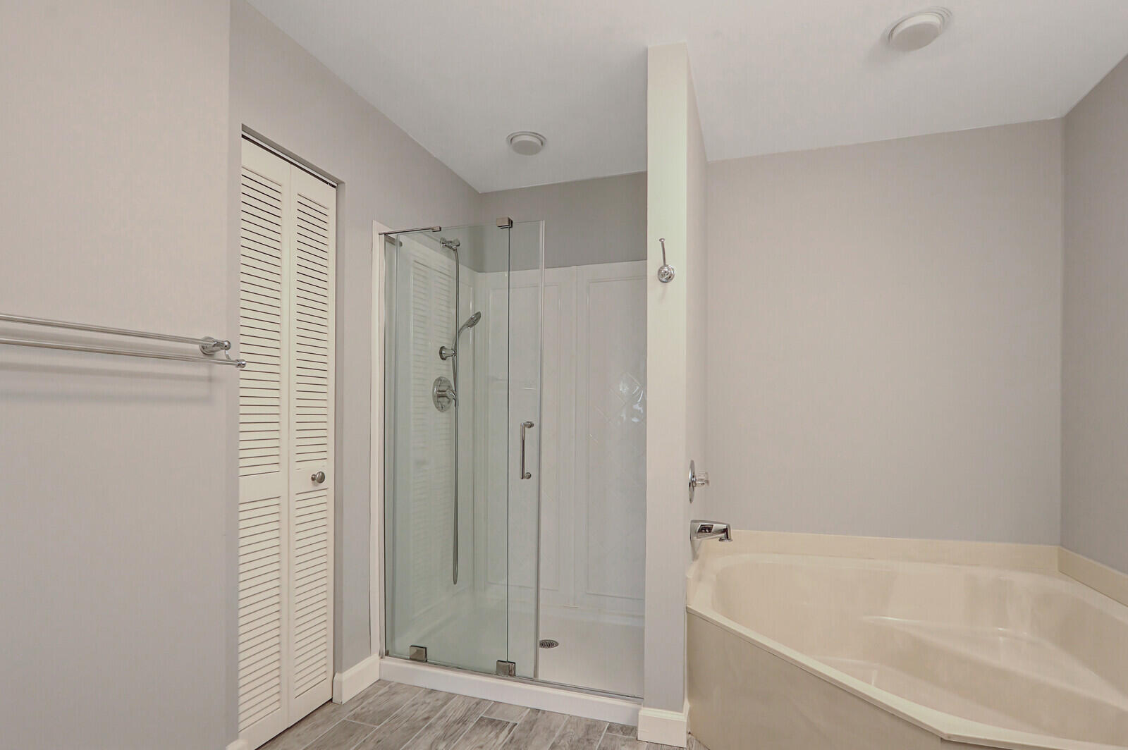 1102 Wingfoot Drive, Unit D Jupiter, FL 33458 - Photo 20 of 30 a bathroom with a bathtub and a shower