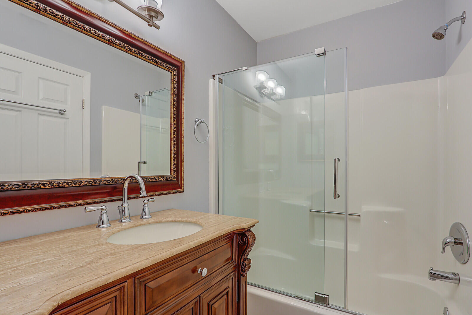 1102 Wingfoot Drive, Unit D Jupiter, FL 33458 - Photo 26 of 30 a bathroom with a sink and a mirror