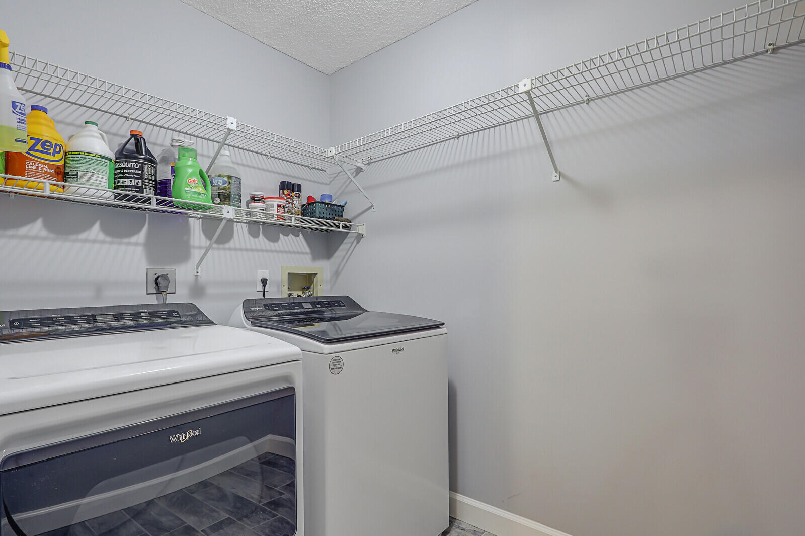1102 Wingfoot Drive, Unit D Jupiter, FL 33458 - Photo 27 of 30 a kitchen with a stove and a refrigerator