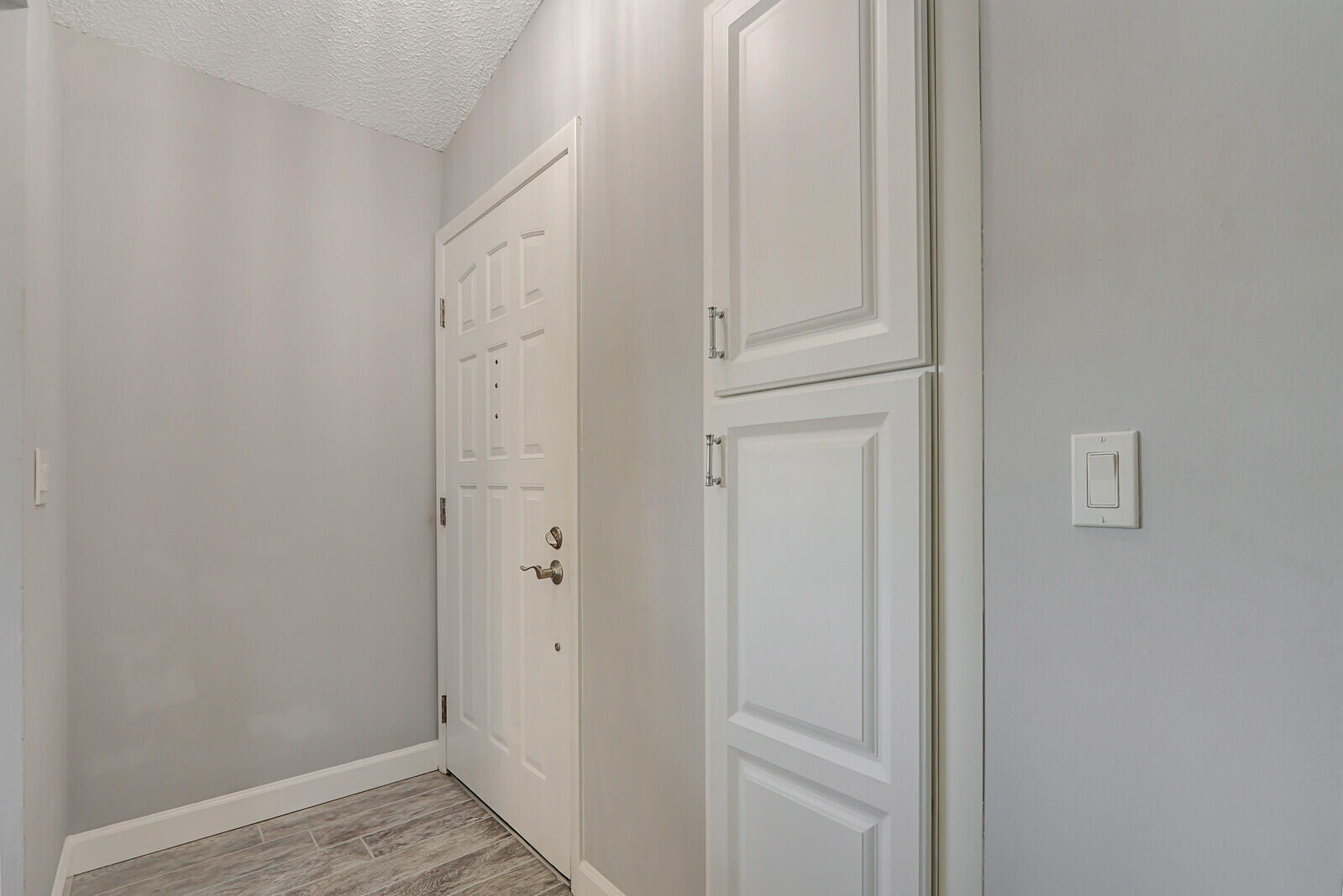 1102 Wingfoot Drive, Unit D Jupiter, FL 33458 - Photo 3 of 30 a view of front door