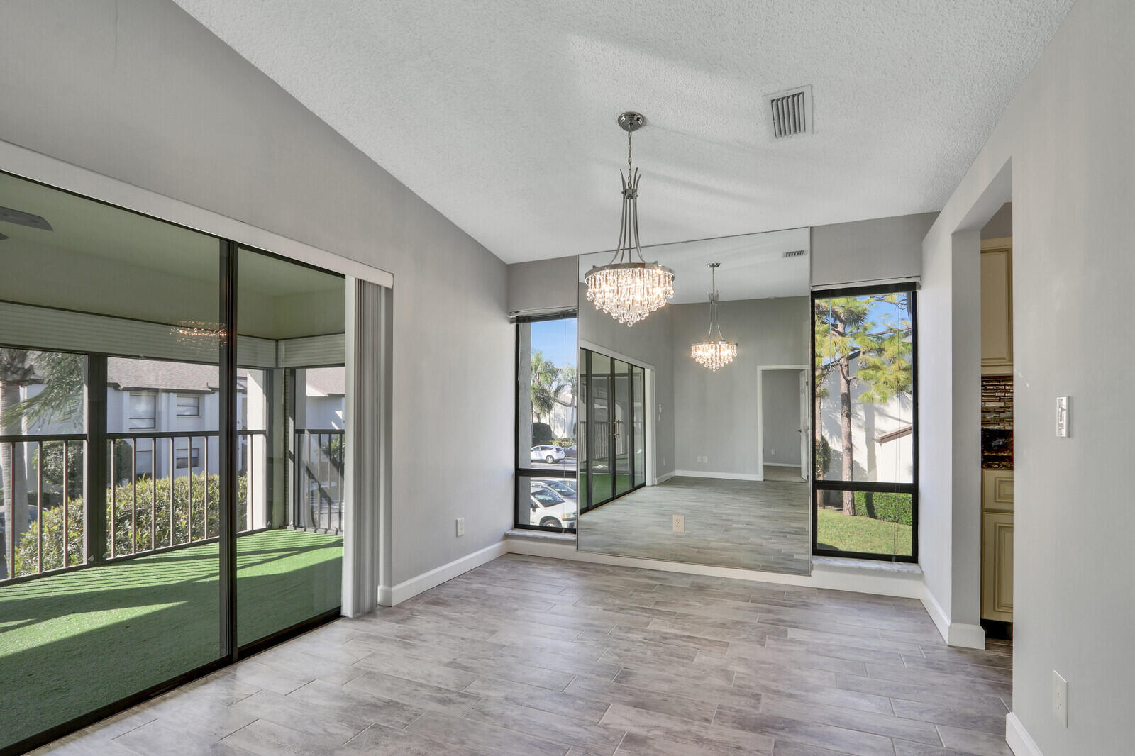1102 Wingfoot Drive, Unit D Jupiter, FL 33458 - Photo 9 of 30 a view of an empty room with a fireplace and a window