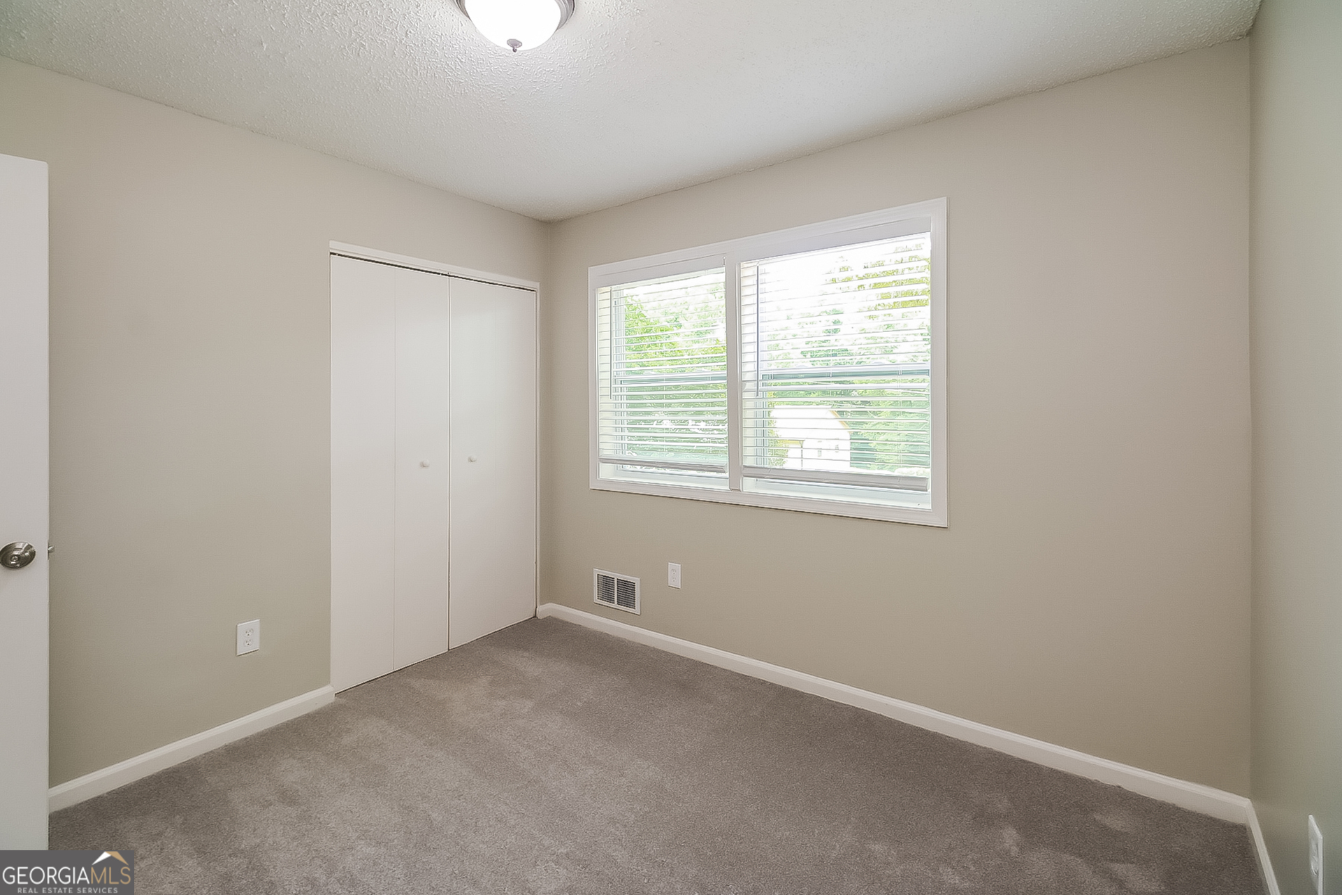 6862 Red Maple Drive Rex, GA 30273 - Photo 11 of 18 an empty room with a window