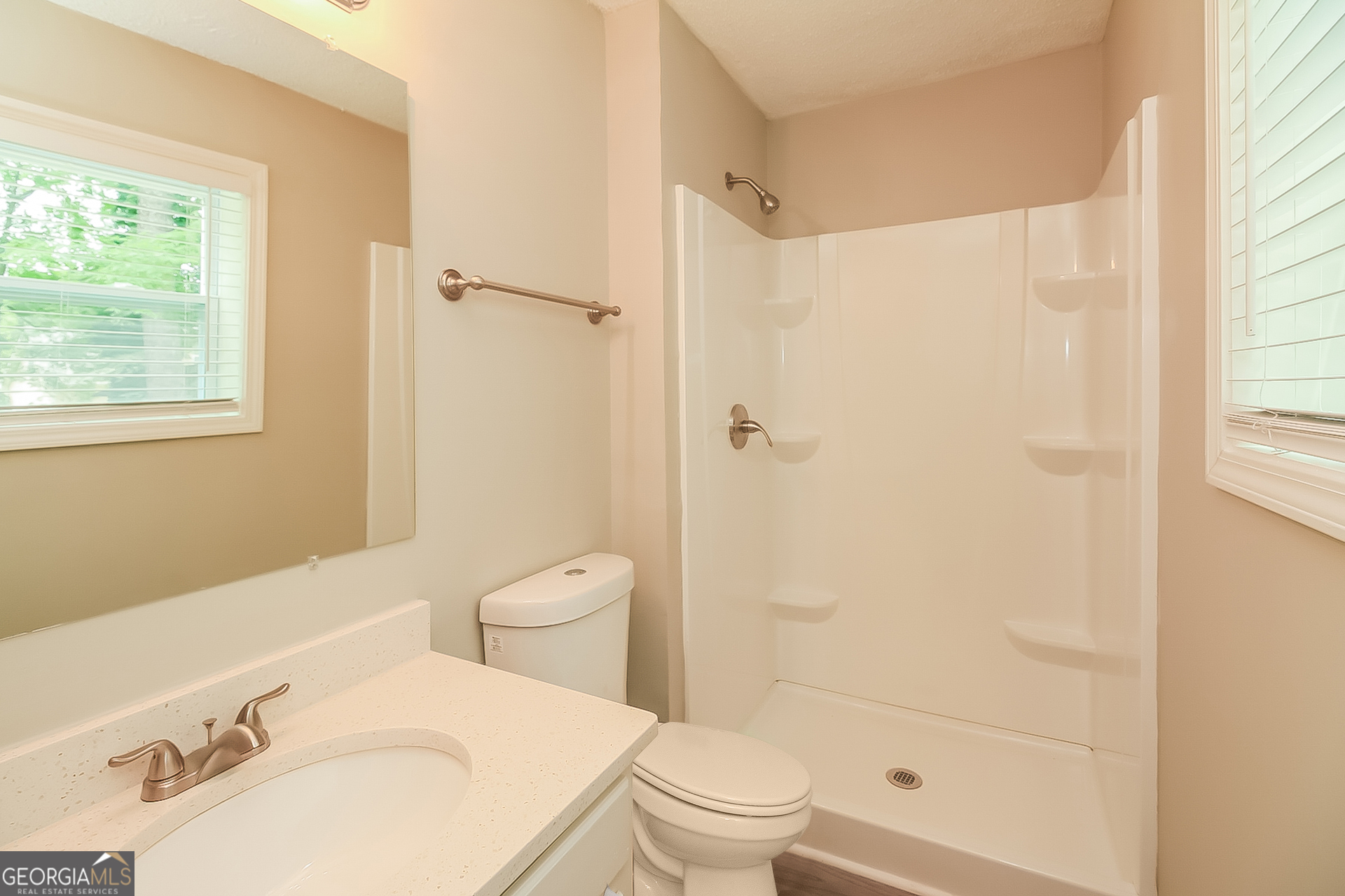 6862 Red Maple Drive Rex, GA 30273 - Photo 13 of 18 a bathroom with a sink toilet and shower