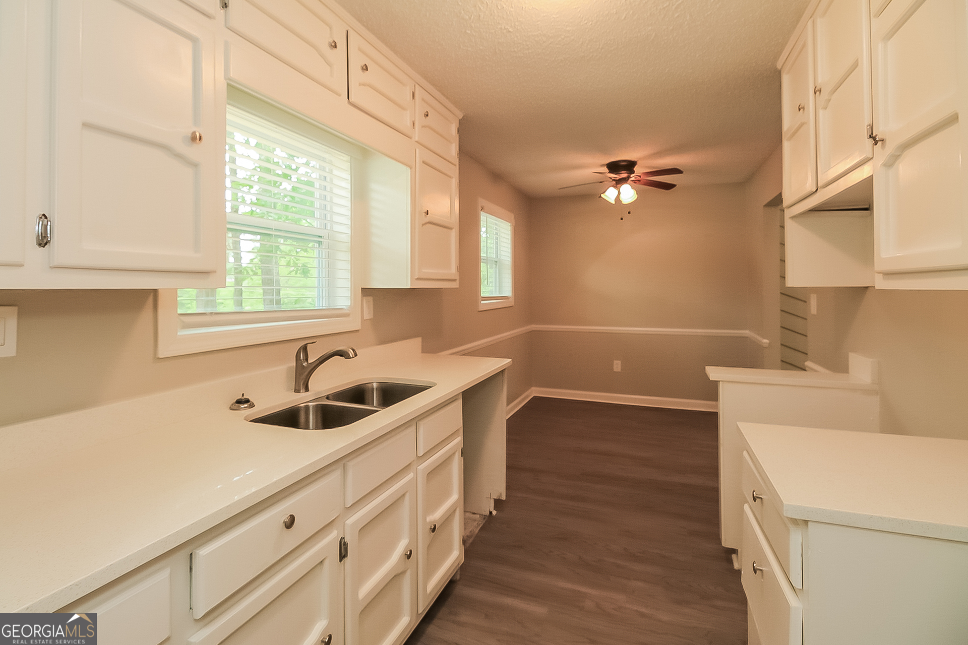 6862 Red Maple Drive Rex, GA 30273 - Photo 5 of 18 a kitchen with a sink a window and cabinets