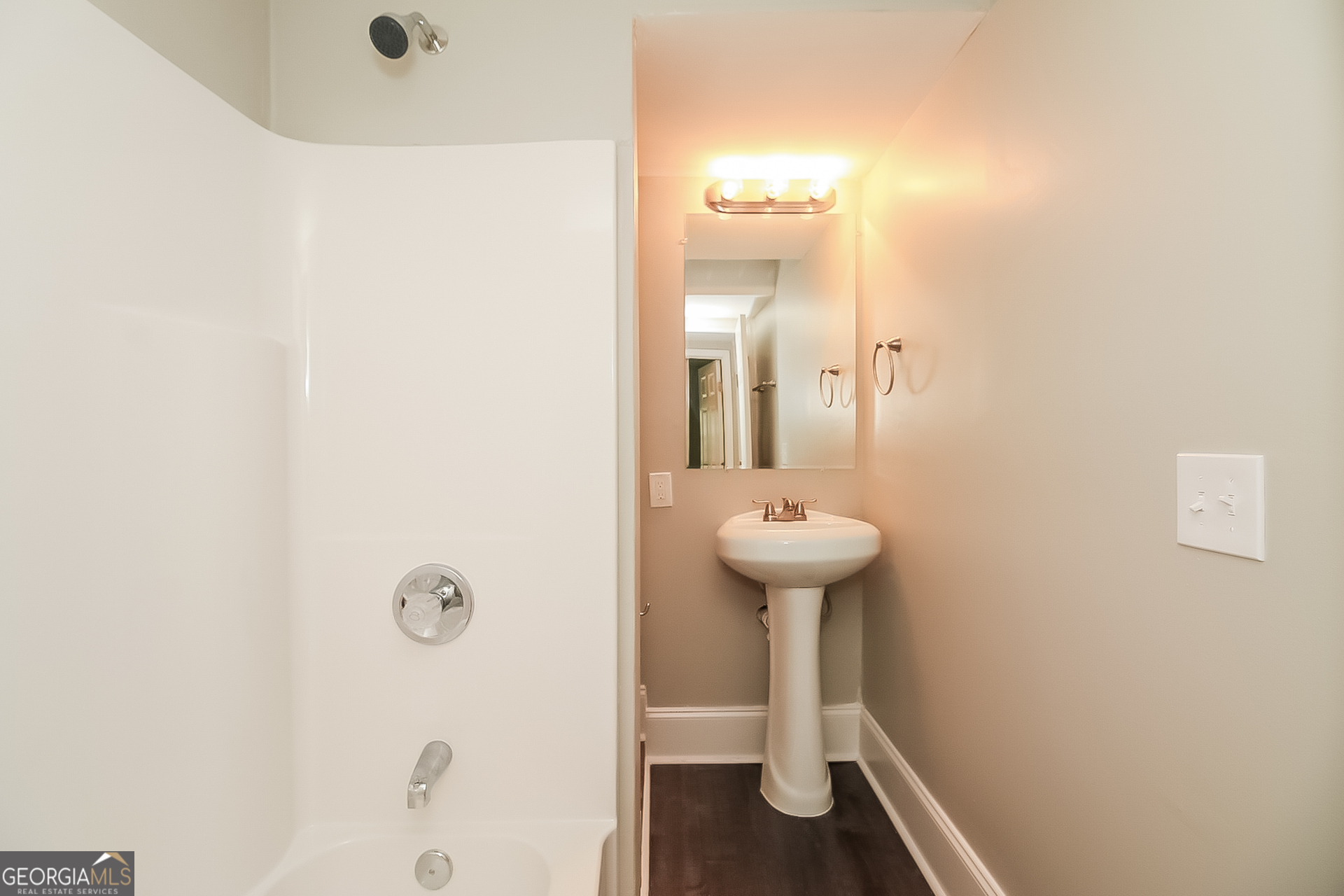 6862 Red Maple Drive Rex, GA 30273 - Photo 9 of 18 a bathroom with a sink and mirror