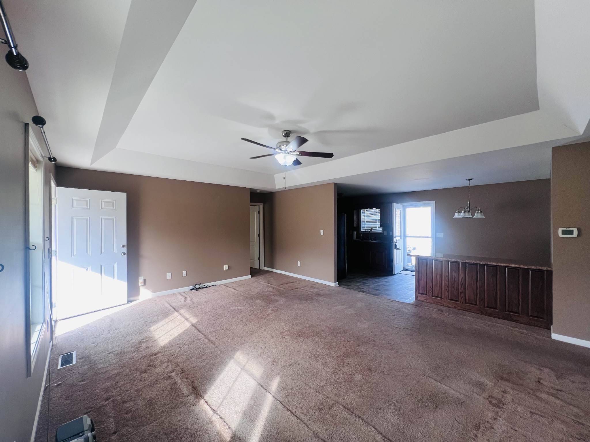 8659 Dog Branch Road Mount Pleasant, TN 38474 - Photo 13 of 36 a view of a livingroom with a ceiling fan & windows