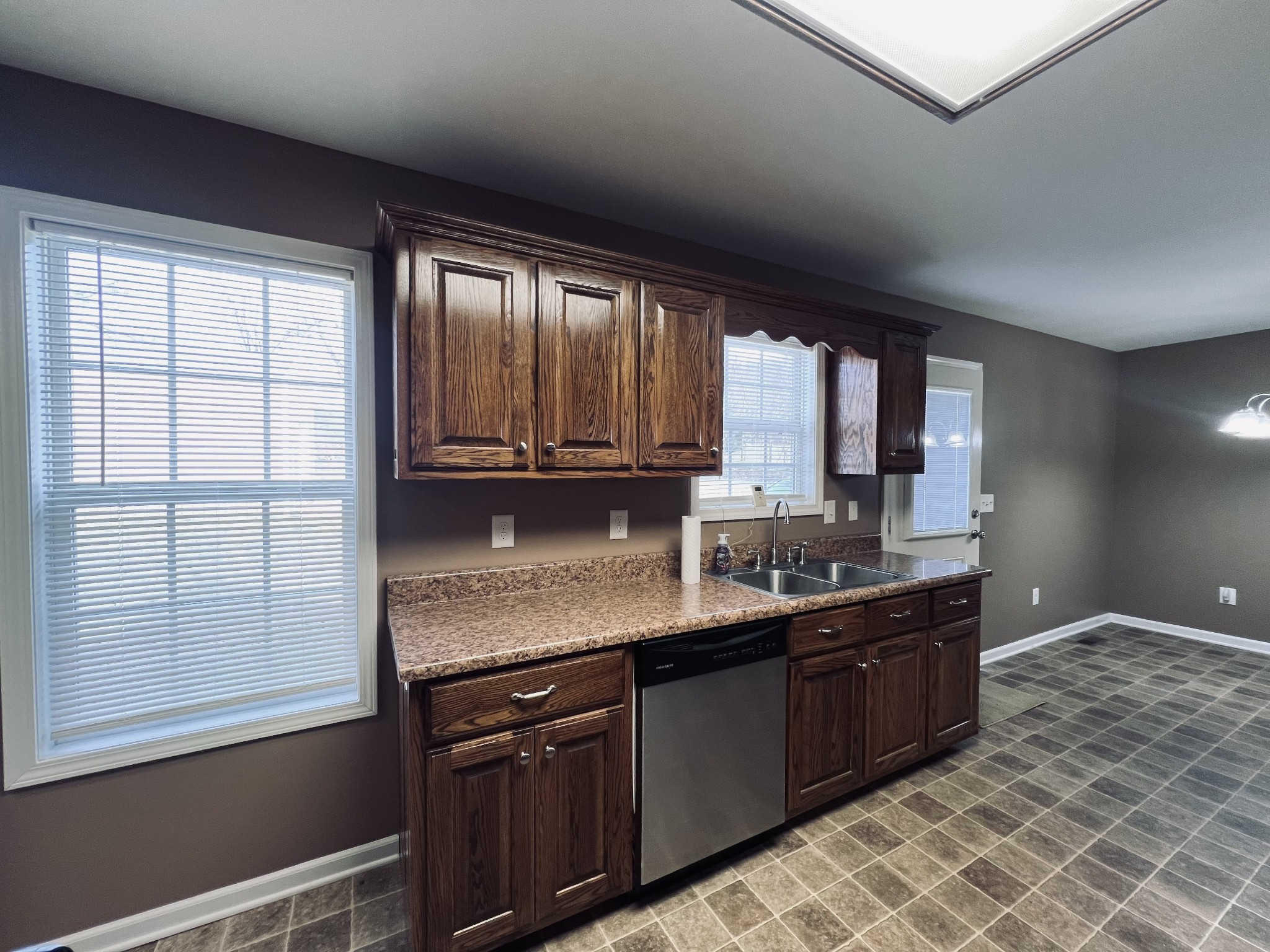 8659 Dog Branch Road Mount Pleasant, TN 38474 - Photo 19 of 36 a kitchen with stainless steel appliances granite countertop a sink stove and cabinets