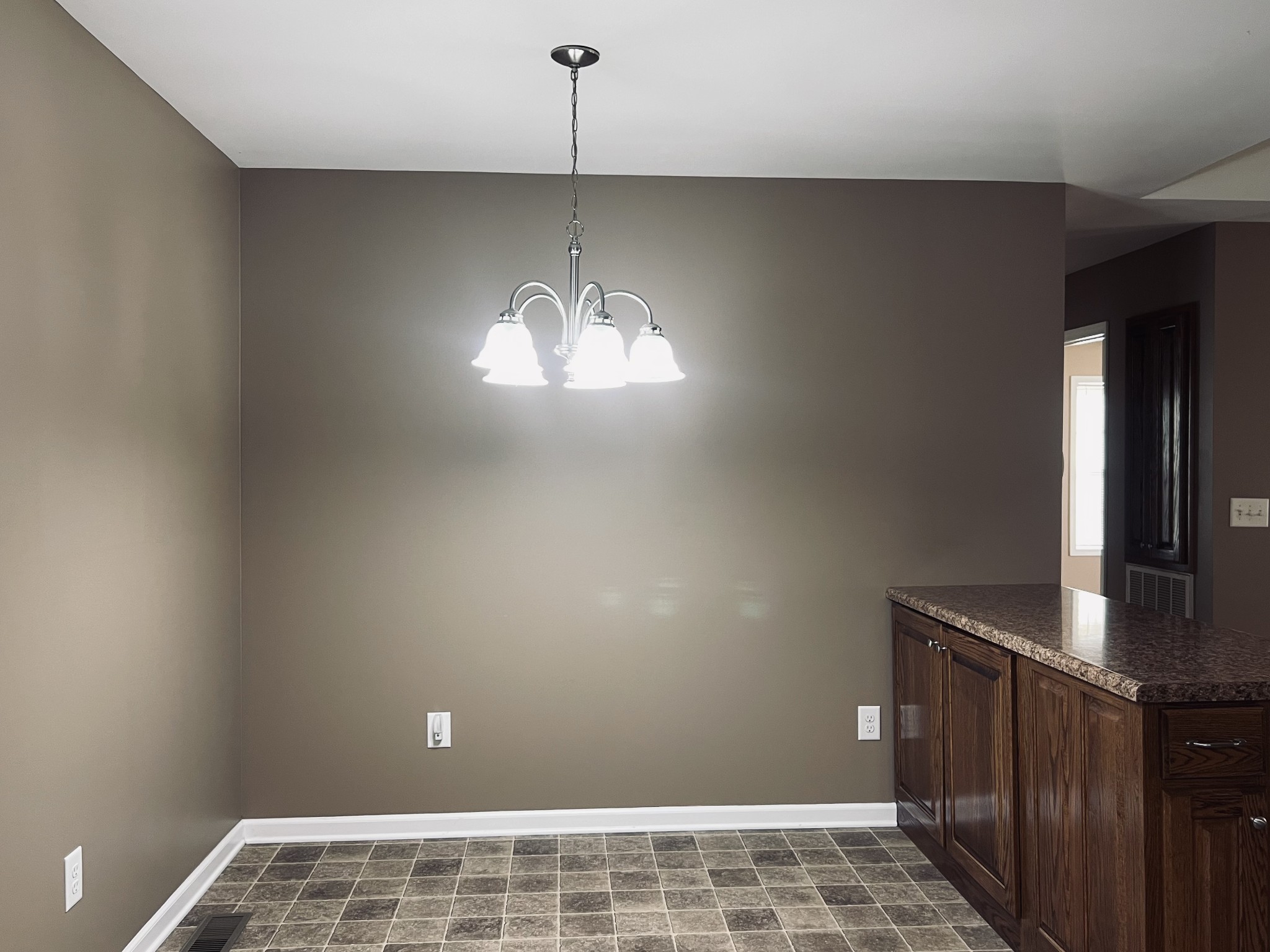 8659 Dog Branch Road Mount Pleasant, TN 38474 - Photo 22 of 36 a view of empty room with window and chandelier