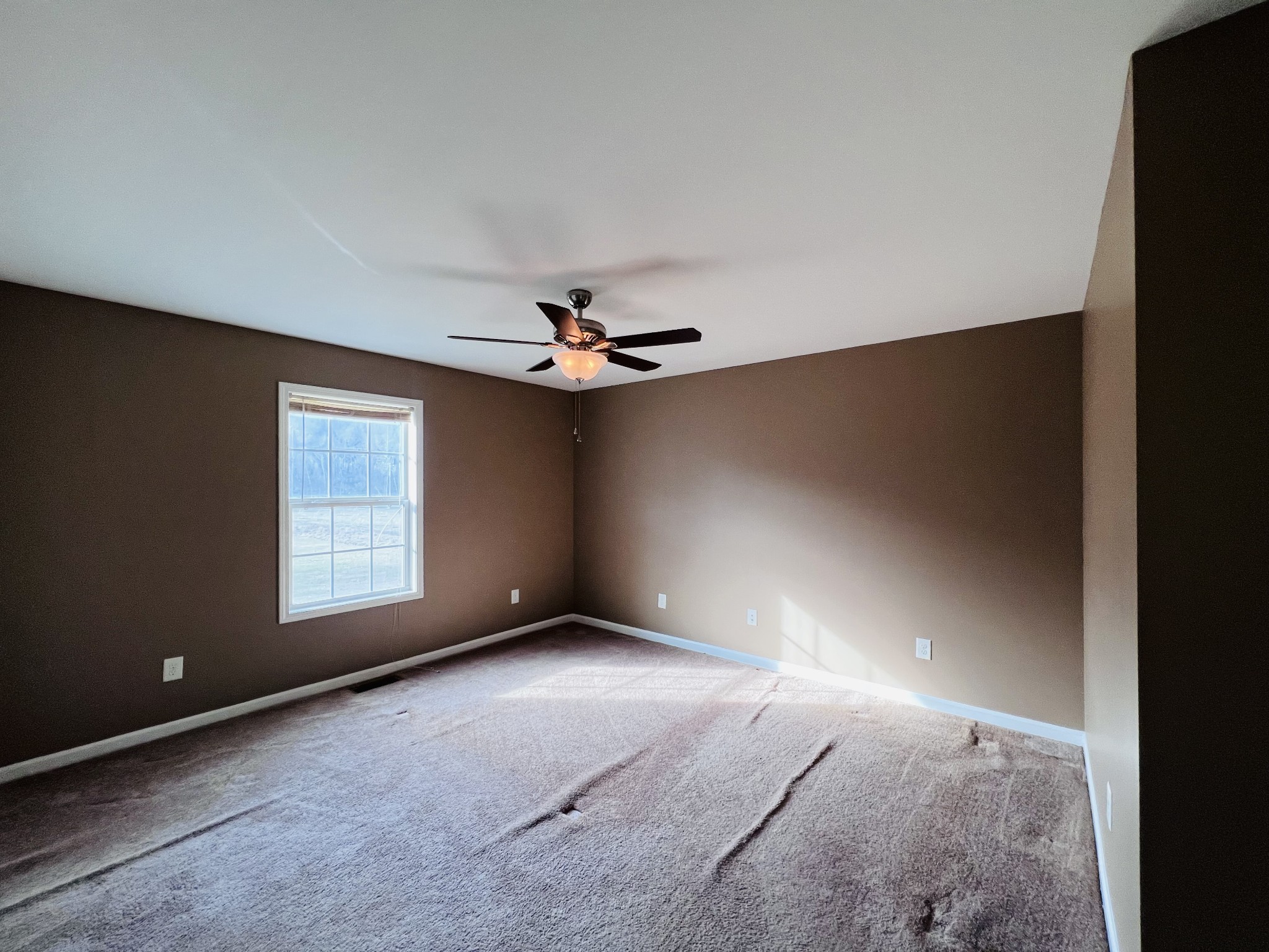 8659 Dog Branch Road Mount Pleasant, TN 38474 - Photo 24 of 36 a view of an empty room with a window