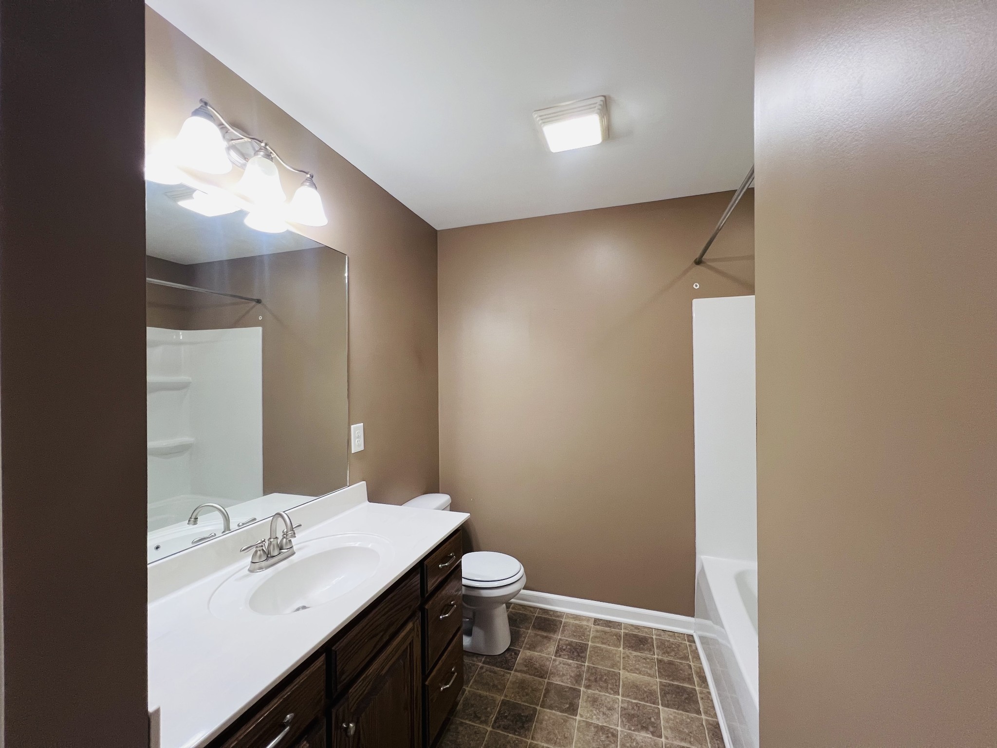 8659 Dog Branch Road Mount Pleasant, TN 38474 - Photo 25 of 36 a bathroom with a sink a toilet and shower