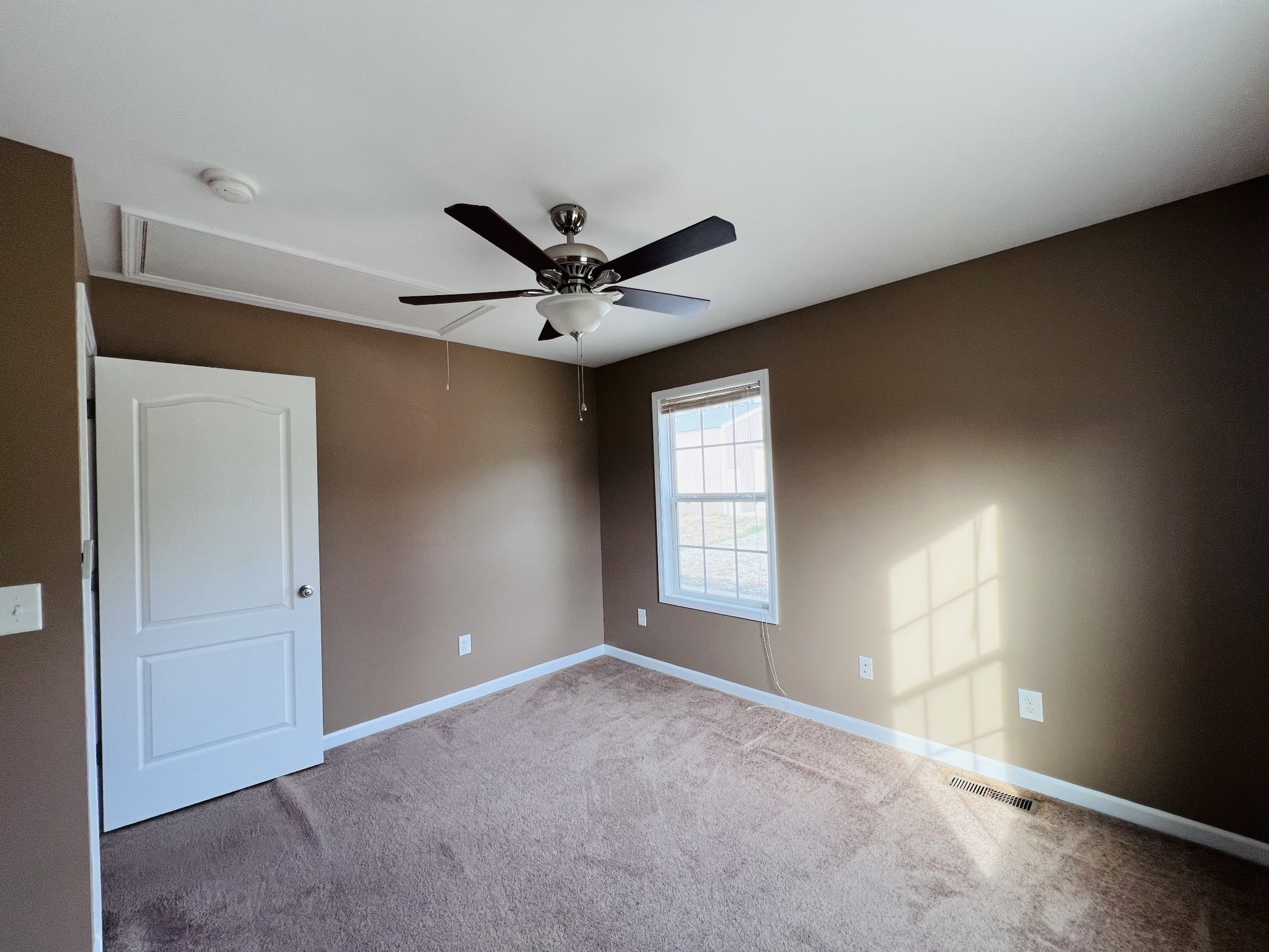 8659 Dog Branch Road Mount Pleasant, TN 38474 - Photo 28 of 36 a view of a livingroom with a ceiling fan and window
