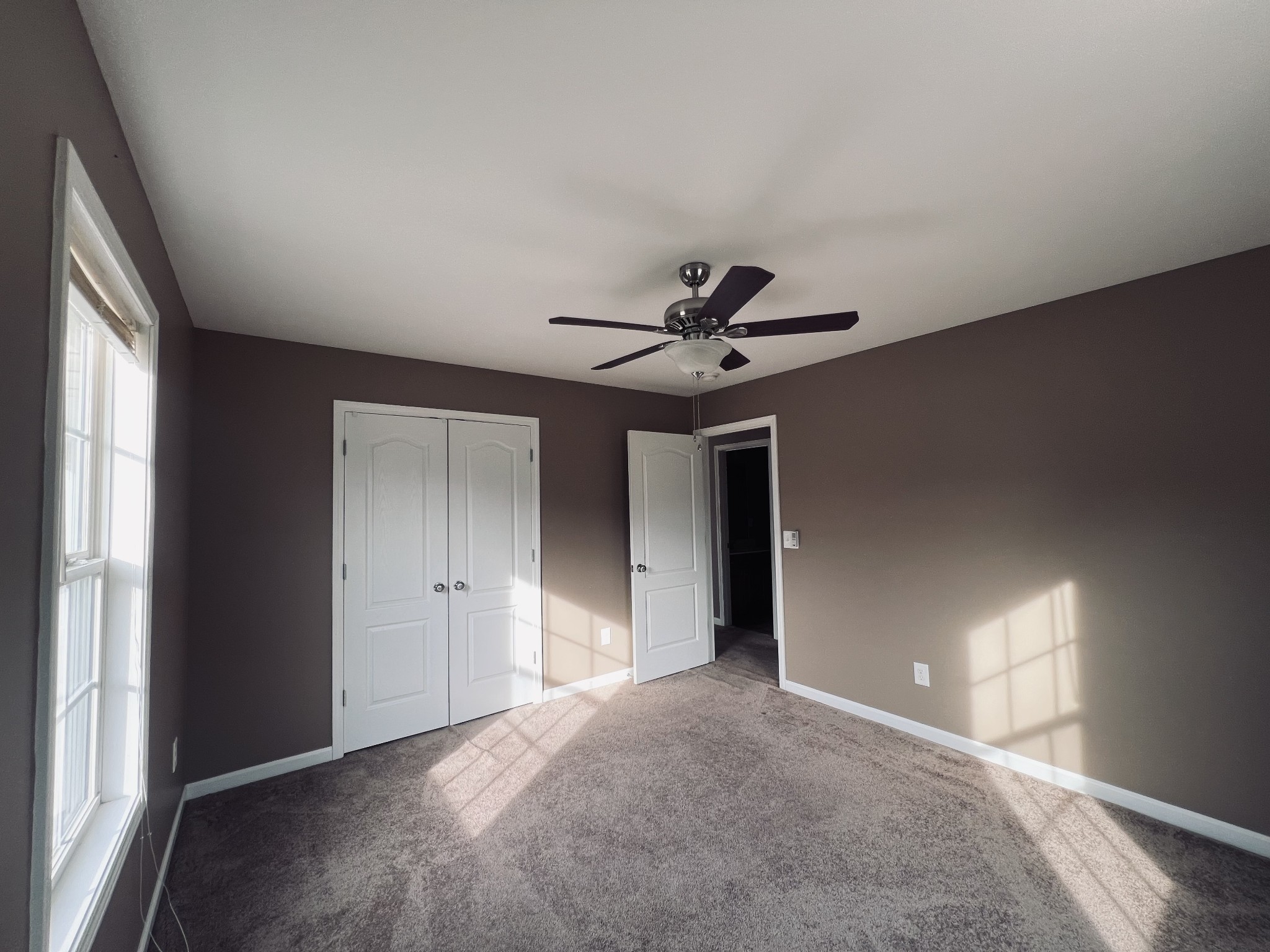 8659 Dog Branch Road Mount Pleasant, TN 38474 - Photo 34 of 36 a view of a livingroom with a ceiling fan and window