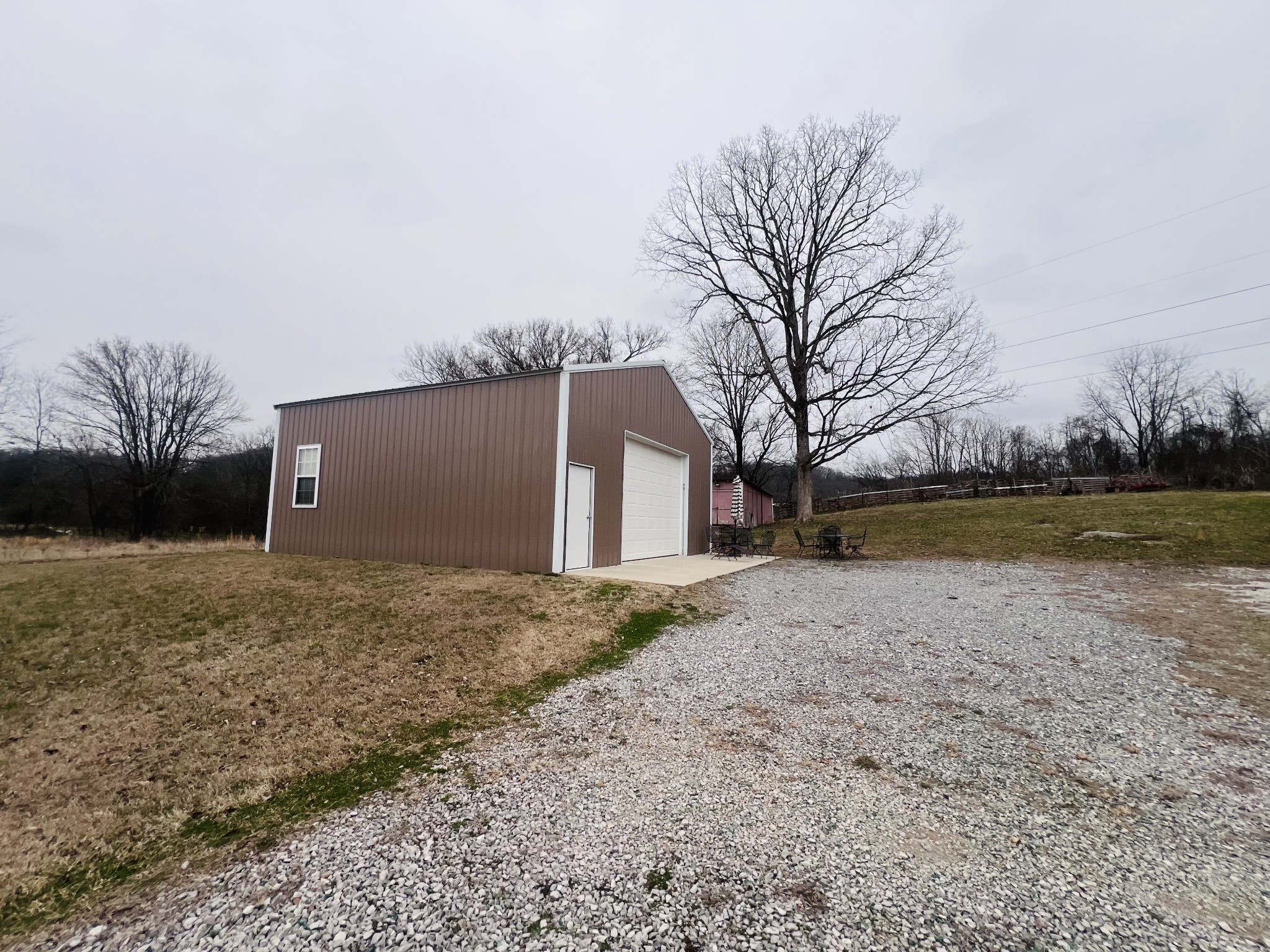 8659 Dog Branch Road Mount Pleasant, TN 38474 - Photo 10 of 36 a view of a house with a yard and garage