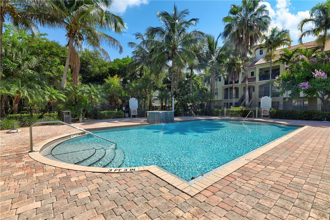 5840 West Sample Road, Unit 308 Coral Springs, FL 33067 - Photo 34 of 54 a view of outdoor space yard and swimming pool