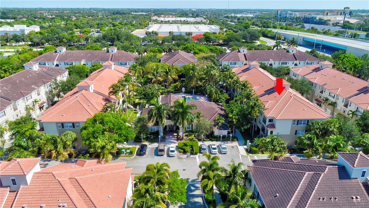 5840 West Sample Road, Unit 308 Coral Springs, FL 33067 - Photo 41 of 54 an aerial view of a houses with a street