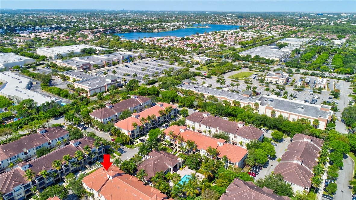 5840 West Sample Road, Unit 308 Coral Springs, FL 33067 - Photo 46 of 54 an aerial view of residential houses with outdoor space