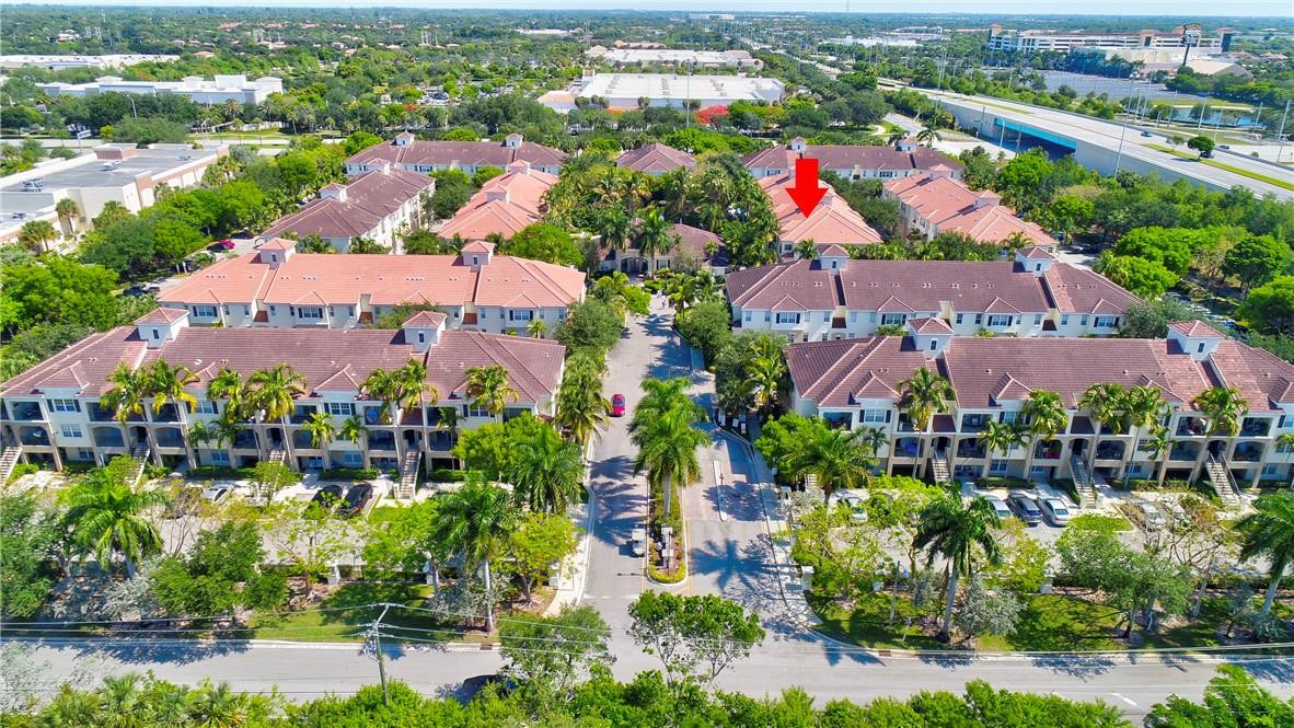 5840 West Sample Road, Unit 308 Coral Springs, FL 33067 - Photo 51 of 54 an aerial view of residential houses with outdoor space and swimming pool
