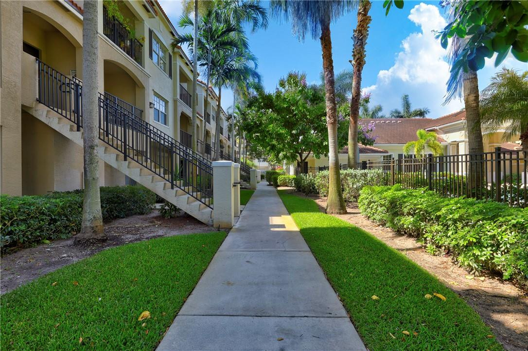 5840 West Sample Road, Unit 308 Coral Springs, FL 33067 - Photo 6 of 54 a view of a street with a building in the background