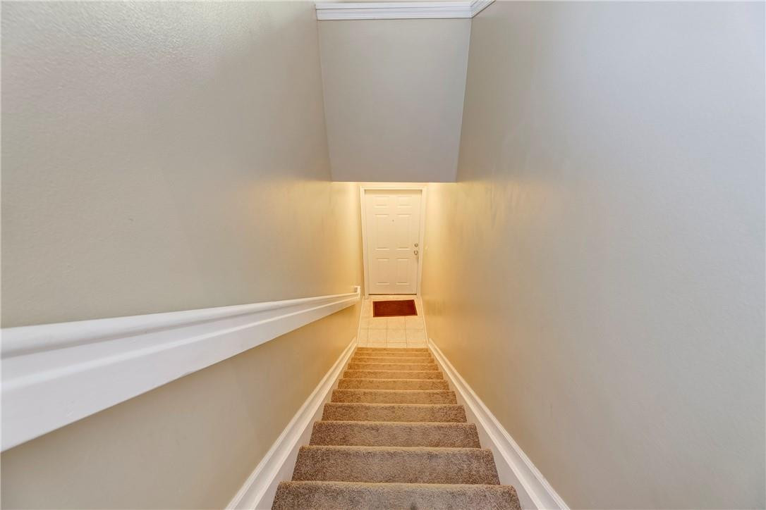 5840 West Sample Road, Unit 308 Coral Springs, FL 33067 - Photo 7 of 54 a view of a hallway with white walls