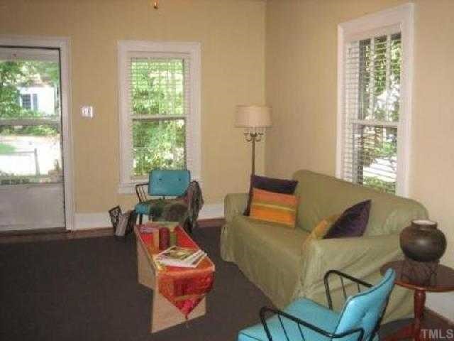 514 Sasser Street Raleigh, NC 27604 - Photo 2 of 12 Upon entry into the living room will greet you with fresh paint, refurnished hardwoods and lots of light with beautiful views. Directly off the living room is the office or another bedroom, see next picture.
