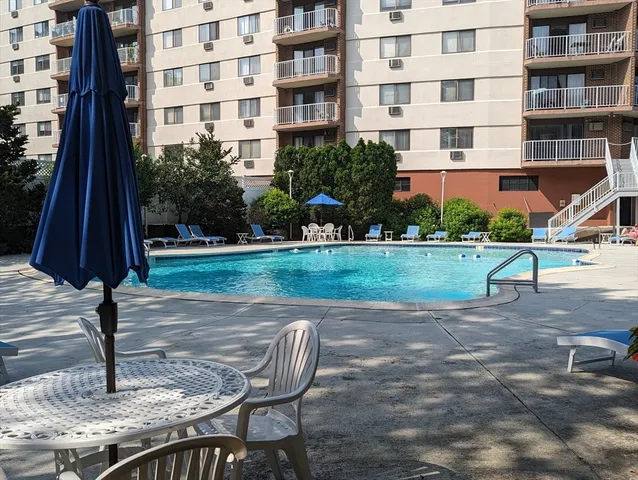 a view of a brick building with a yard