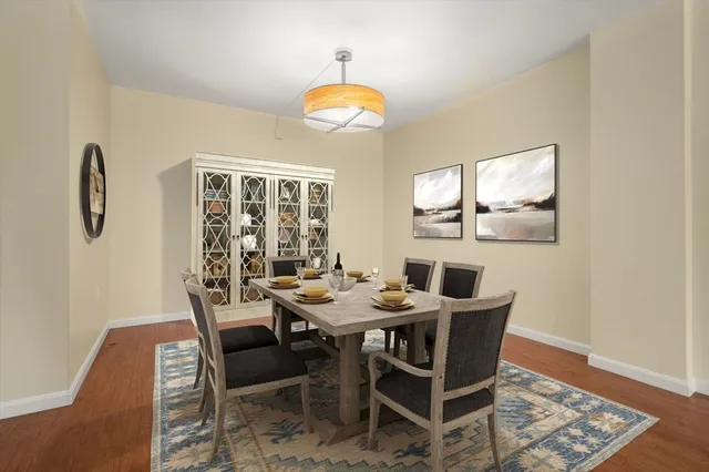 a view of a dining room with furniture and chandelier