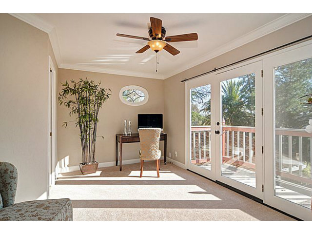 16100 Viewfield Road Monte Sereno, CA 95030 - Photo 12 of 25 a living room with furniture and a floor to ceiling window
