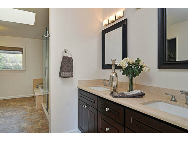 16100 Viewfield Road Monte Sereno, CA 95030 - Photo 14 of 25 a bathroom with a sink vanity and mirror