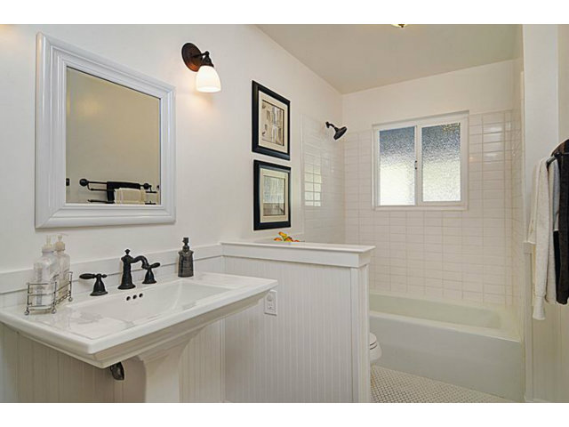 16100 Viewfield Road Monte Sereno, CA 95030 - Photo 17 of 25 a bathroom with a sink and a mirror