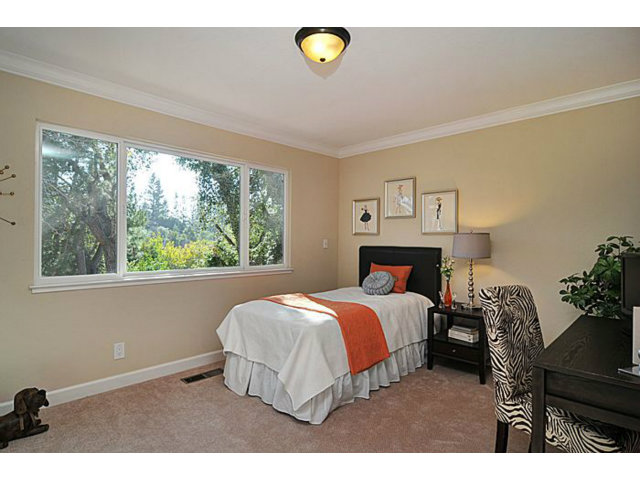 16100 Viewfield Road Monte Sereno, CA 95030 - Photo 18 of 25 a bedroom with a bed and a window