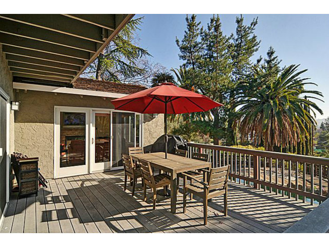 16100 Viewfield Road Monte Sereno, CA 95030 - Photo 21 of 25 a view of a table and chairs under an umbrella