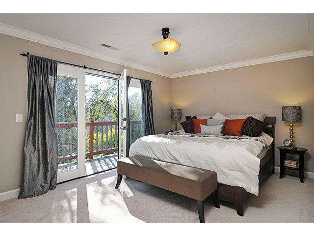 16100 Viewfield Road Monte Sereno, CA 95030 - Photo 9 of 25 a bed sitting in a bedroom next to a window
