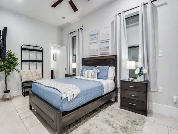 a bedroom with a bed and a dresser