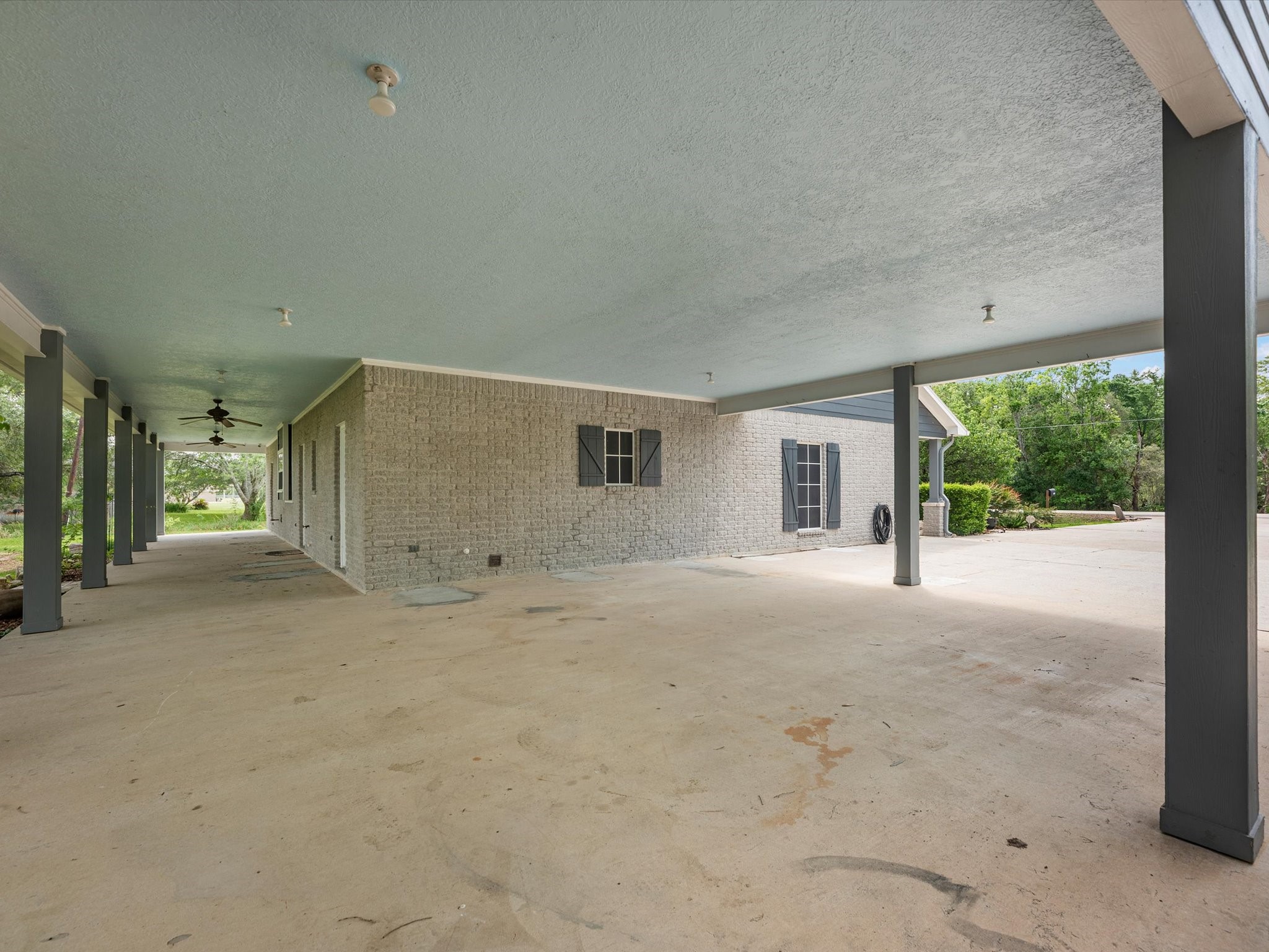 2600 Euell Road Crosby, TX 77532 - Photo 8 of 42 Large, 2-car, attached carport, extending to the covered back porch area. Shade is not hard to come by here