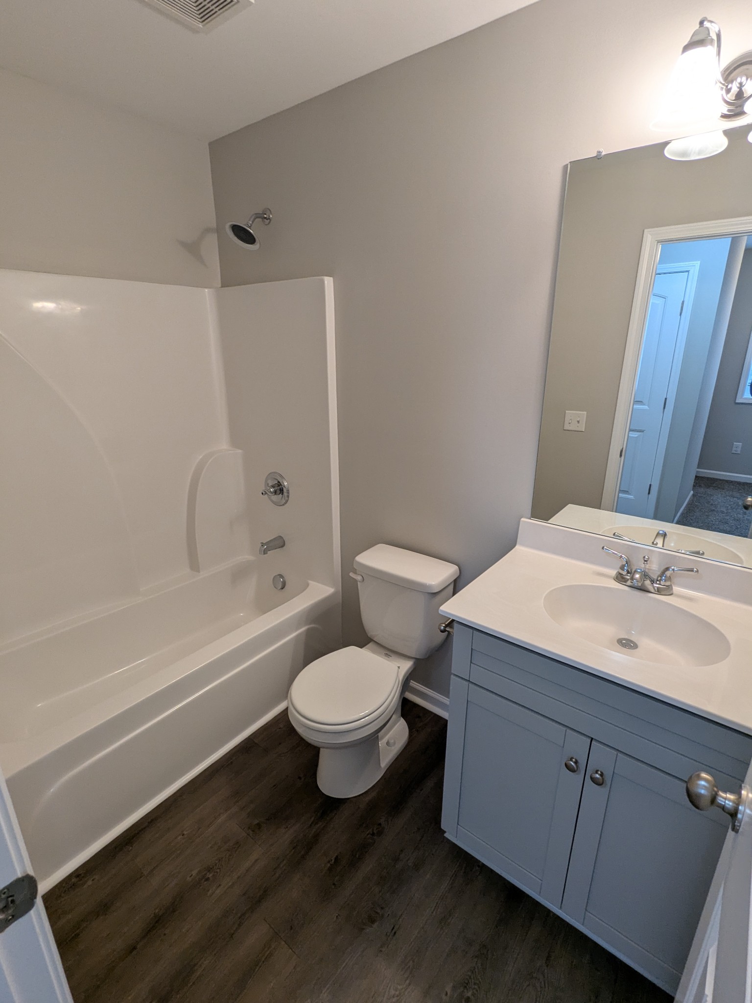 710 Pippin Drive Antioch, TN 37013 - Photo 13 of 16 a bathroom with a sink toilet a mirror and shower