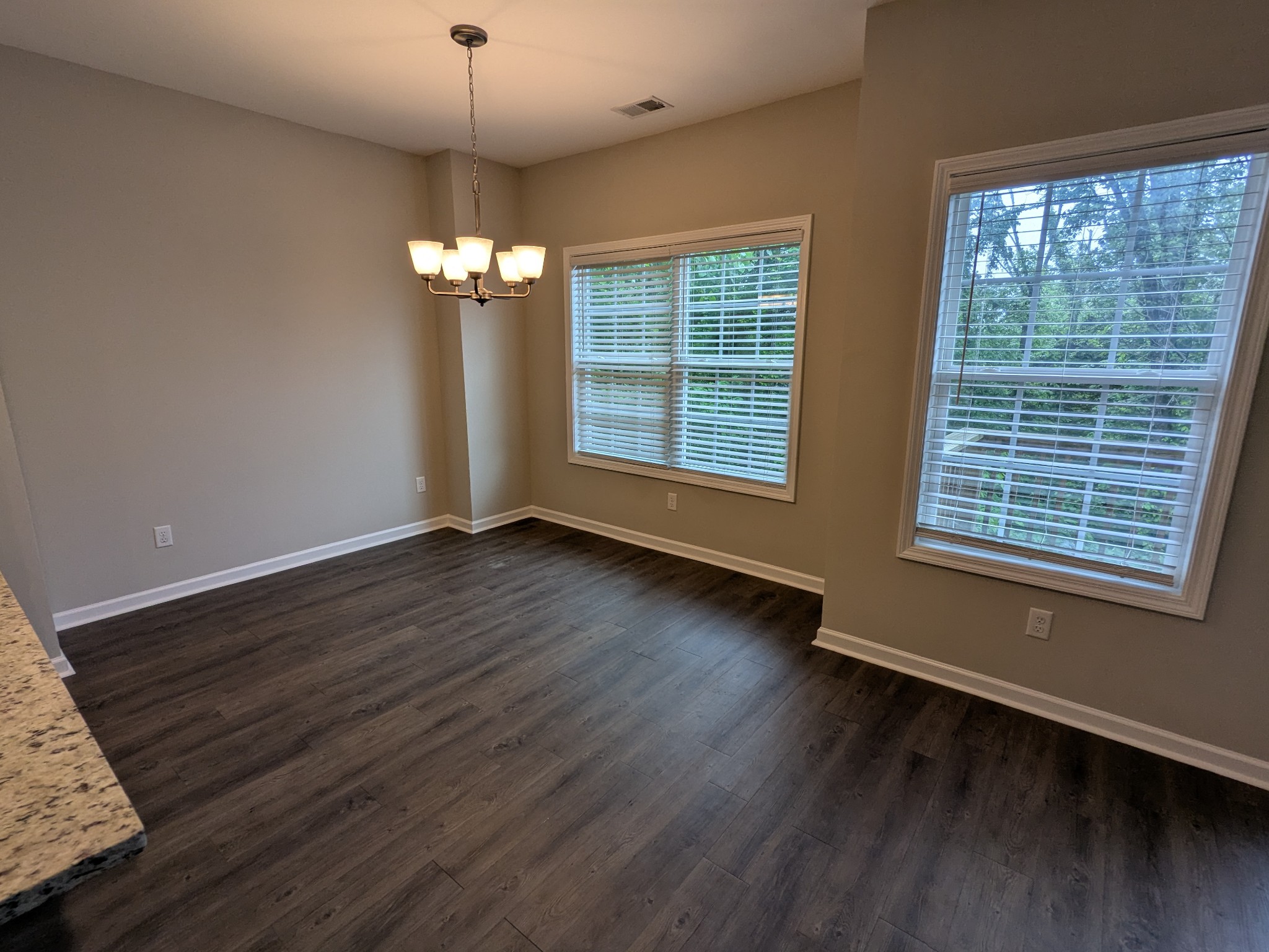 710 Pippin Drive Antioch, TN 37013 - Photo 9 of 16 a view of an empty room with wooden floor and a window