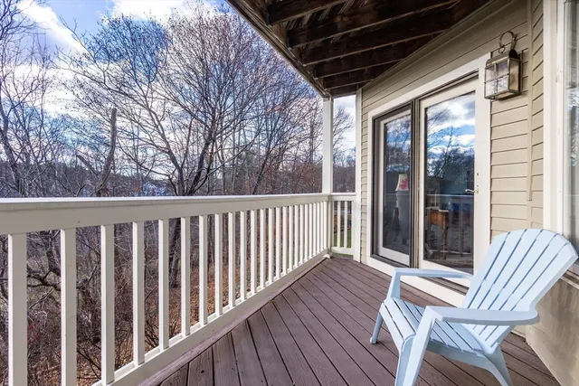 a view of deck with wooden floor and outdoor seating