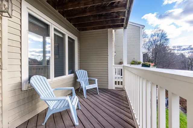 a view of a chair and table in the balcony