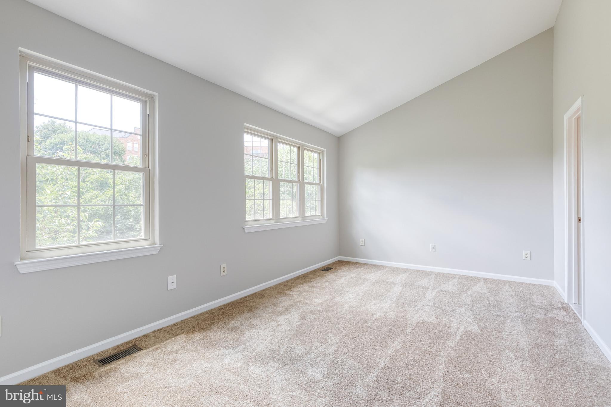7327 Eden Brook Drive, Unit E30 Columbia, MD 21046 - Photo 11 of 40 an empty room with windows