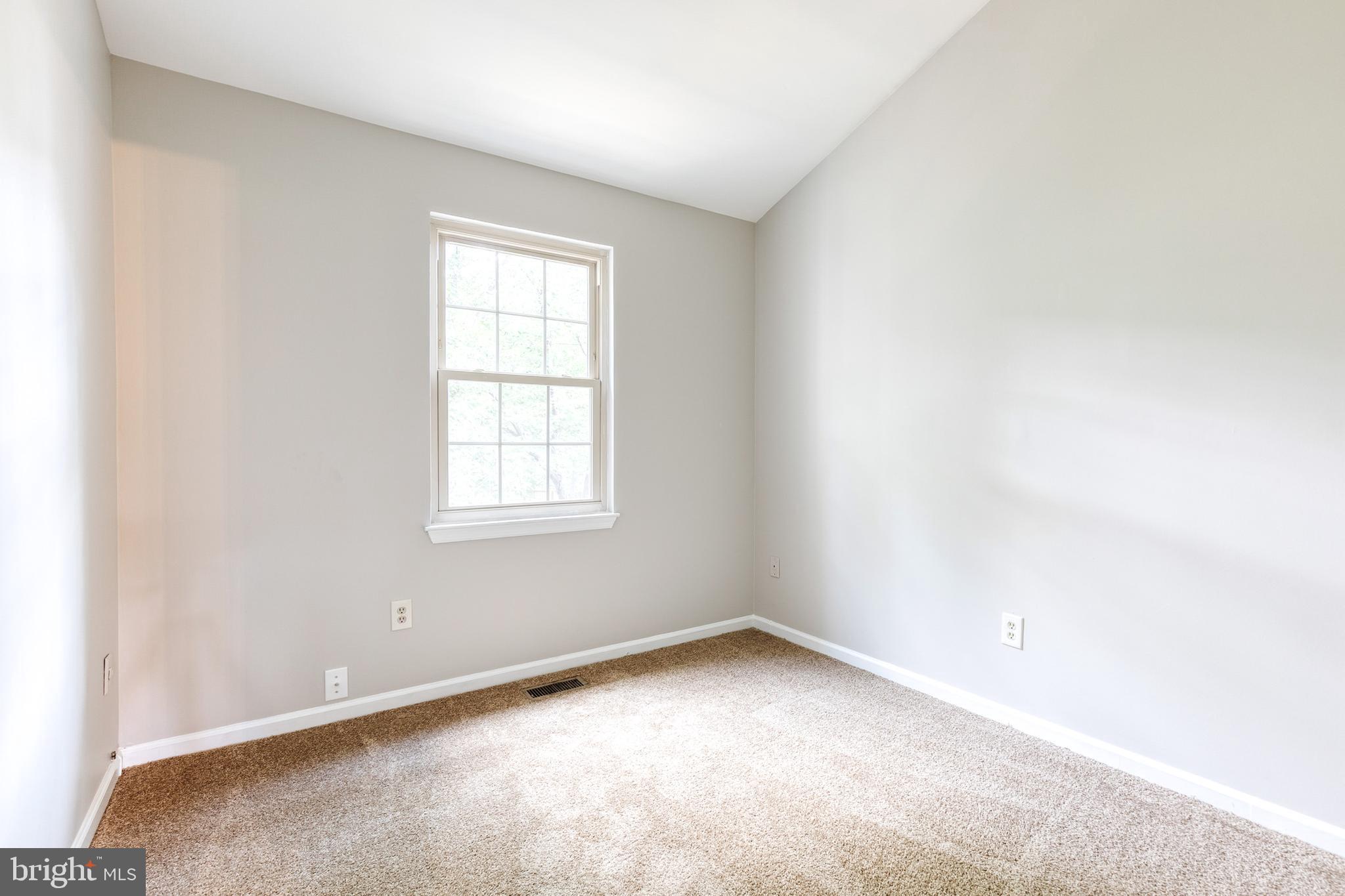 7327 Eden Brook Drive, Unit E30 Columbia, MD 21046 - Photo 31 of 40 an empty room with a window