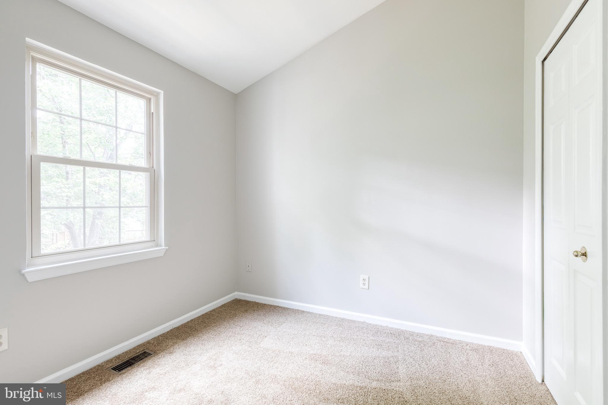 7327 Eden Brook Drive, Unit E30 Columbia, MD 21046 - Photo 32 of 40 an empty room with a window