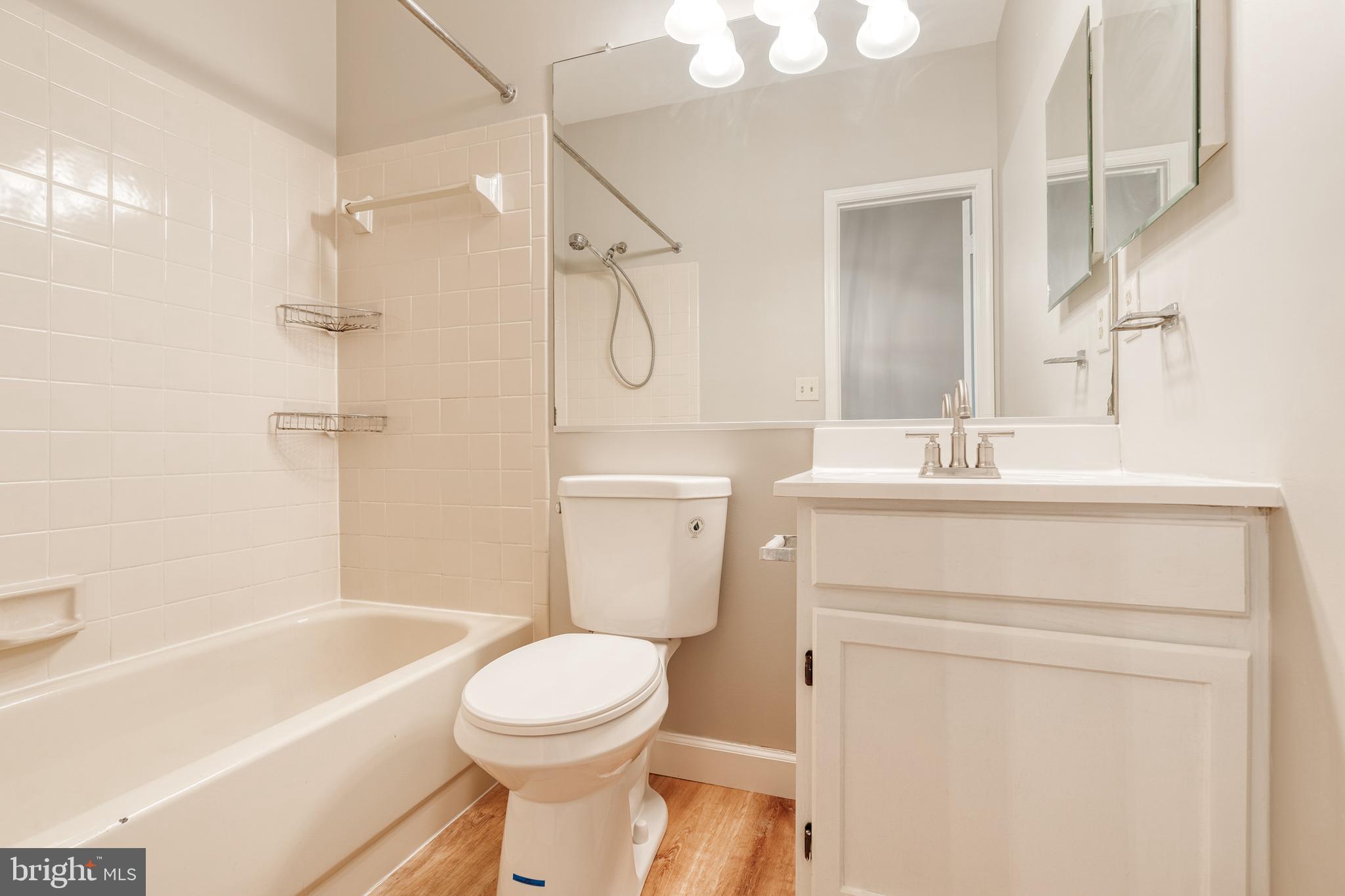 7327 Eden Brook Drive, Unit E30 Columbia, MD 21046 - Photo 34 of 40 a bathroom with a sink toilet and shower