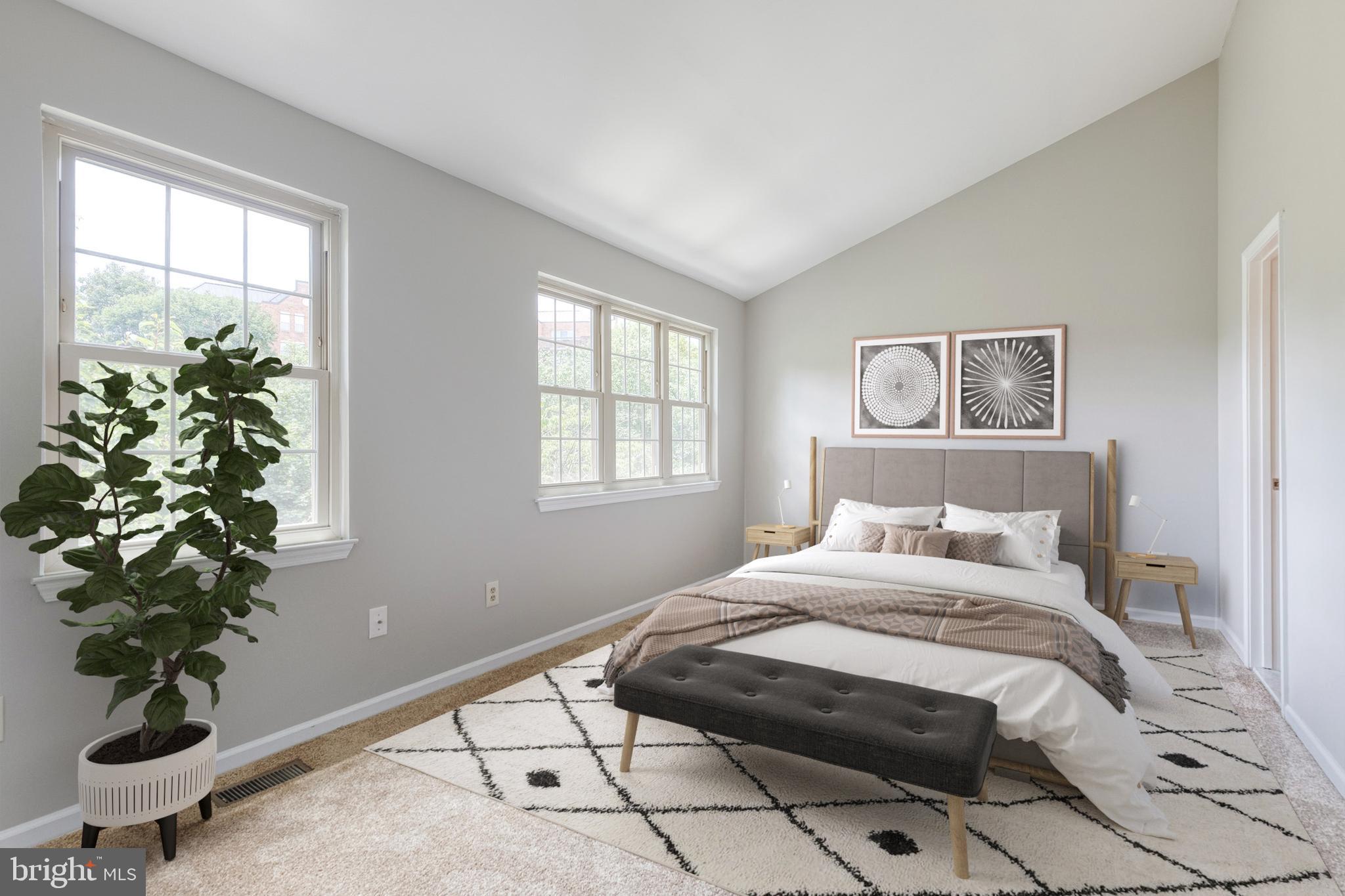 7327 Eden Brook Drive, Unit E30 Columbia, MD 21046 - Photo 10 of 40 a bedroom with a bed and a potted plant