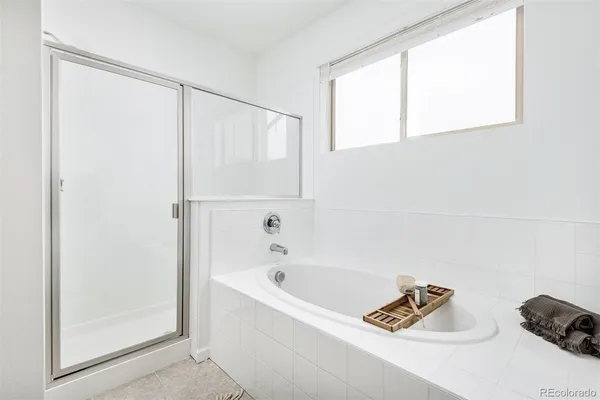 a bathroom with a bathtub and a window