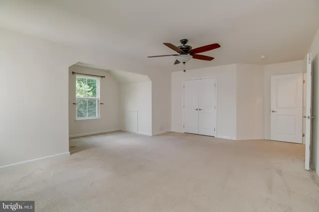 a bathroom with a toilet and a bathtub